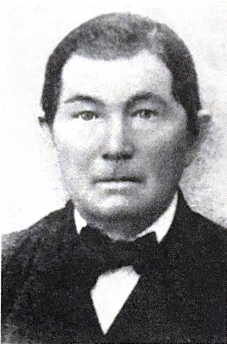 Portrait of Christian Guebert in formal attire with bow tie