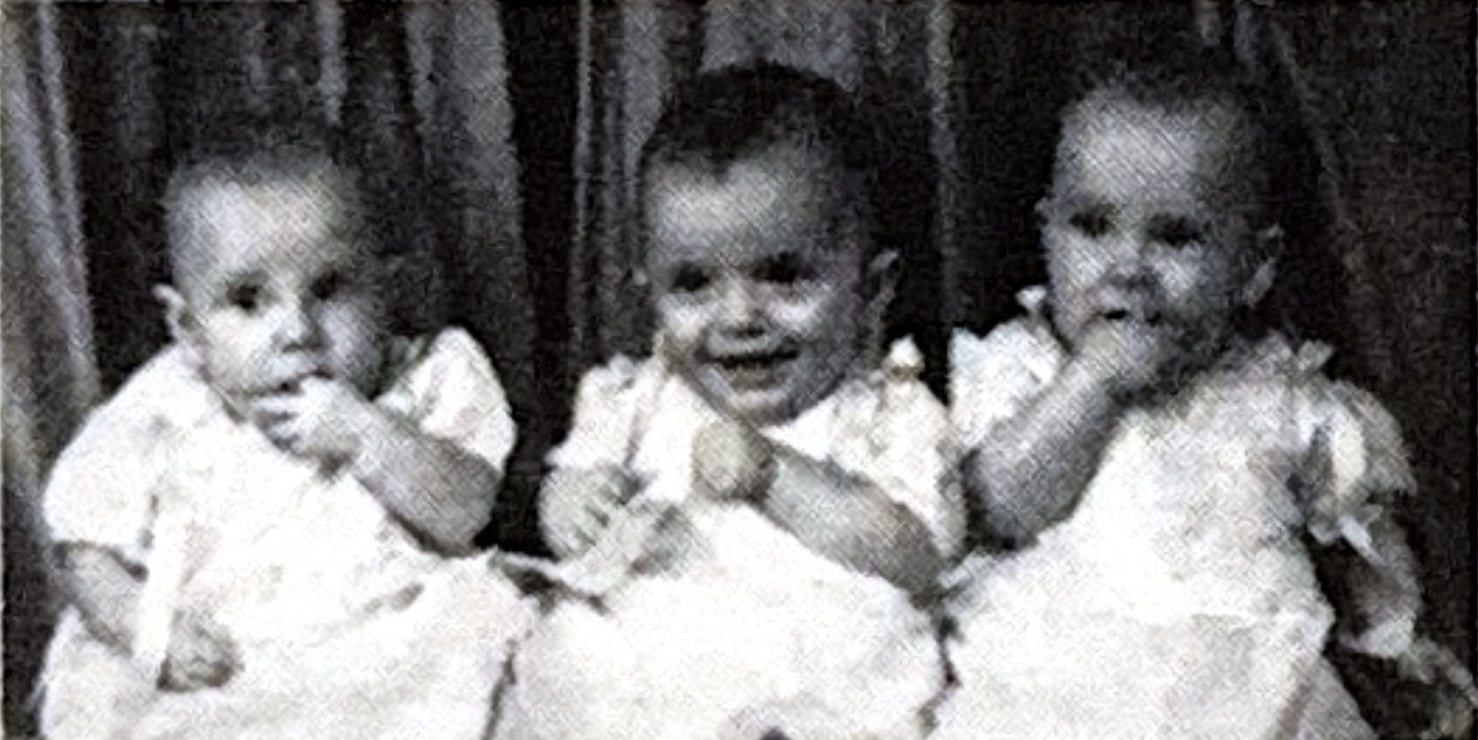 Portrait of three young children (the triplets)